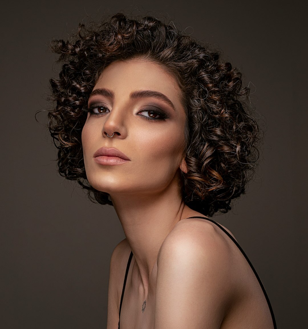Studio portrait of a professional woman with curly hair