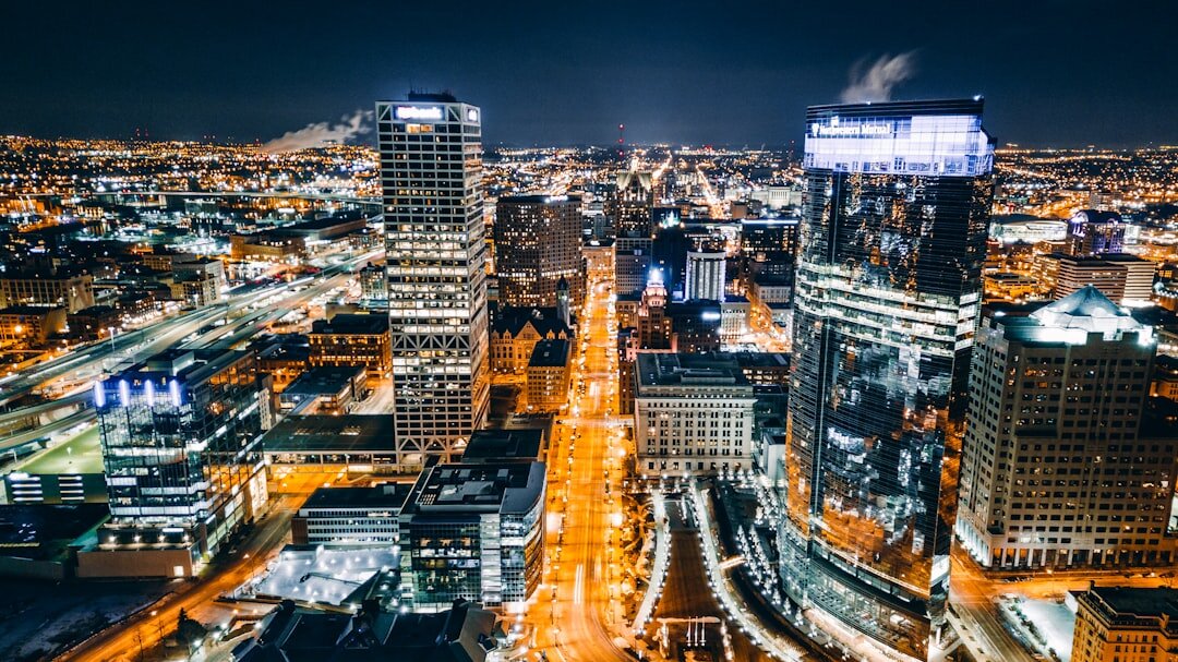 European city skyline at dusk with illuminated buildings